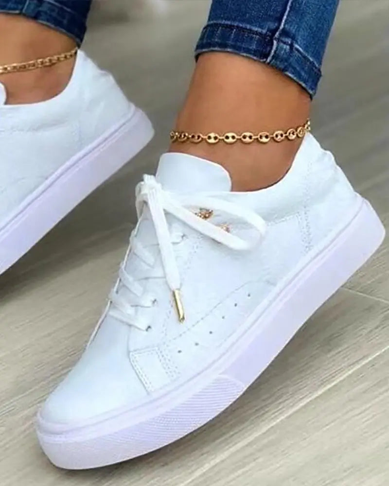 JO | Chic sneakers with golden details