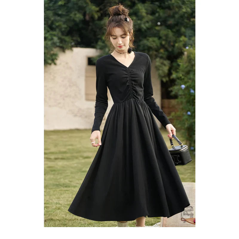 JO | Elegant Black Knitted Smocked V-Neck A-Line Midi Dress